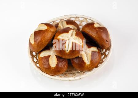 German Pretzel Rolls in Basket on White Background - Traditional Breakfast Bakery Snack Stock Photo