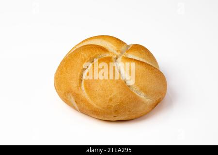 Side view of Kaiser roll on white table. Stock Photo