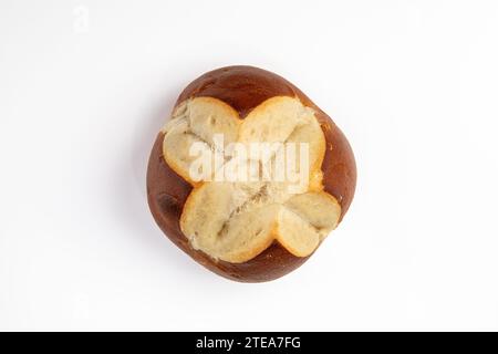 Top View of a Single Pretzel Roll on a White Table Stock Photo