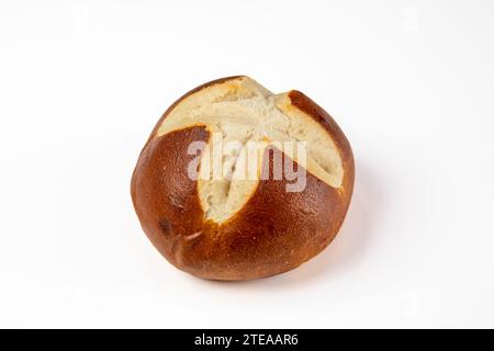 Side View of Fresh Pretzel Roll on White Table - Bakery Delicacy Stock Photo