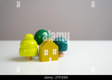 The house is surrounded by trees. Live in harmony with nature. Clean ecology and autonomous technologies. Design and architectural services. Real esta Stock Photo