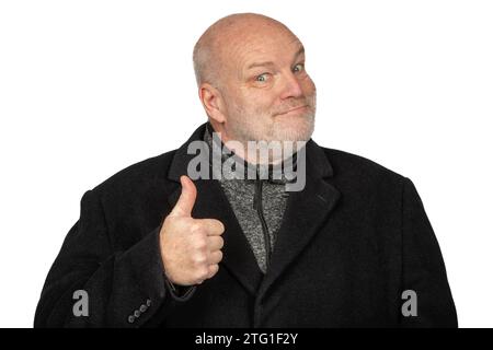Confident 58-Year-Old Man in Winter Coat Giving Thumbs Up on White Background Stock Photo