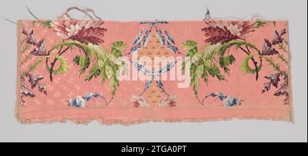 Silk fragment with a pattern of a multicolored spiral branch and wine red carnation on hard pink soil ,, 1745 - 1755 Silk fragment with Gros de Tours in the height of incomplete, symmetrical pattern: two bending over -plumy leaf branches in bright green, each make a spiral around a black stem of a carnation in wine red, pink and white (cut off). On the outside pearly, sliding chalice flowers, on the indoor sides of thin blue tifles that enclose window fields, on which green straw is. The stock is strewn in the same color with small motifs such as moths and diabolos. France (possibly) silk. Sil Stock Photo