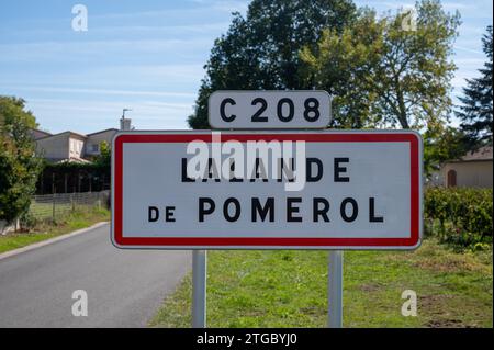 City road sign Lalande de Pomerol near Saint-Emilion wine making region, growing of Merlot or Cabernet Sauvignon red wine grapes, France, Bordeaux in Stock Photo