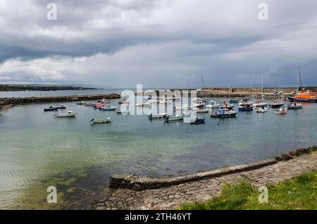 Portrush, County Antrim, Northern Ireland May 19 2021 - Portrush harbour with yachts and small fishing boats also an RNLI rescue boat Stock Photo