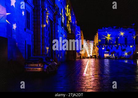 Valletta's old town at Christmas with illuminated house facades and lush fairy lights in the alleyways. Valletta, Malta Stock Photo