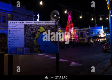 Evacuation plan in the event of a tsunami in Marsaxlokk, Malta. Squares in Malta are bathed in colorful light before Christmas Stock Photo