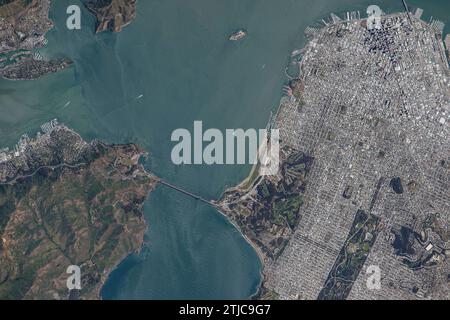 Astronaut Scott Kelly took this image of San Francisco during his One Year Mission to the International Space Station. He was also a member of Expedition 43 on the orbiting laboratory. The Golden Gate Bridge is clearly visible. San Francisco, California, USA. San Francisco is the fourth most populous city in California, with 808,437 residents, and the 17th most populous city in the United States as of 2022.    An Optimised version of an original NASA image / Credit: NASA / S Kelly Stock Photo