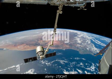 The International Space Station's Canadarm2 prepares to release the Orbital Science Corporation's commercial cargo craft after a month visiting the orbital outpost. ESA astronaut Alexander Gerst and NASA astronaut Reid Wiseman, both Expedition 40 flight engineers, were at the controls of the robotics workstation in the Cupola removing Cygnus from the Harmony node then safely releasing it. 15 August 2014. Much of South Africa provides the panoramic background for the scene, with the Cape of Good Hope in the lower right of the frame An Optimised version of an original NASA image / Credit: NASA Stock Photo