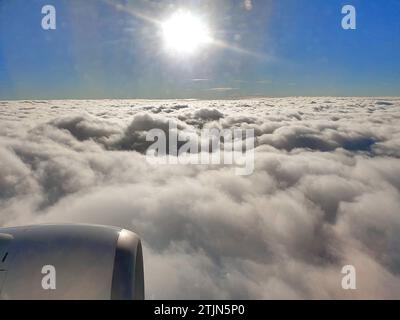 Flying above the clouds in a passenger airliner.  Credit: JHelebrant Stock Photo