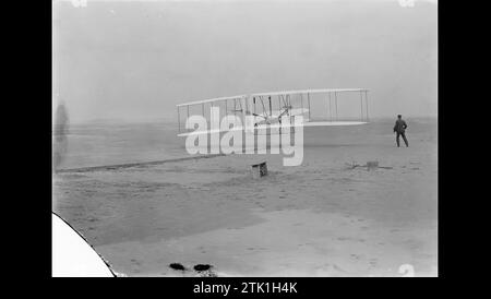 North Carolina, USA. 17th Dec, 2023. FILE: Orville Wright makes the first powered, controlled flight on Earth as his brother Wilbur looks on in this image taken at Kitty Hawk, North Carolina, on December 17, 1903. Orville Wright covered 120 feet in 12 seconds during the first flight. The Wright brothers made four flights that day, each longer than the last. Credit: Library of Congress/ZUMA Press Wire/ZUMAPRESS.com/Alamy Live News Stock Photo