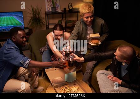 Carefree Students Hanging out at Home Stock Photo