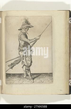Soldier who pushes Kruit and Bullet with his drawer and bullet in the course of his musket (no. 27), ca. 1600, 1597 - 1608 A soldier, to the right, to the right, who holds a musket (a certain type of firearm) with his left hand at his left thigh and with his right hand brings his loading stick to push and bullet (no. 27), 1600. In his left hand in addition to the musket, but also a furket (musket fork) and a wick. Plate 27 in the instructions for handling the musket: Shorte Instruction for the Figures, So Much Concerneth the Right use of Muskett. Part of the illustrations in an English edition Stock Photo