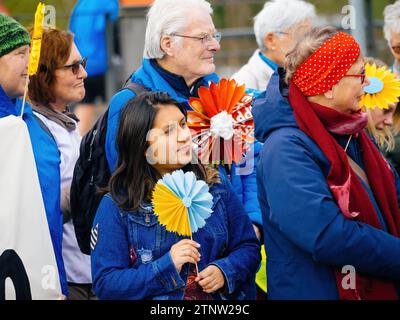 Strasbourg, France - Mar 29, 2023: Group of determined Swiss adults and seniors peacefully protesting in front of the European Court for Human Rights Stock Photo