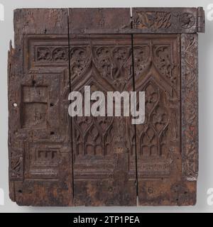 Oak door, Anonymous, 1500 Door of oak (from a cupboard?), From three widths. The space for the final plate and the inlet slot has been saved, the remaining outlined midfield is decorated with blind tracing and two donkey back arches on columns with alternately checkered and tormented shaft. The batter consists of flat tires that frame midfield. They are decorated with openwork vendors of Gothic 'Drieblad'. Drieblad and heraldic lily alternate in the upper edge. Seizure of old base layer. Northern France (possibly) wood (plant material). oak (wood). iron (metal). textile materials Door of oak ( Stock Photo