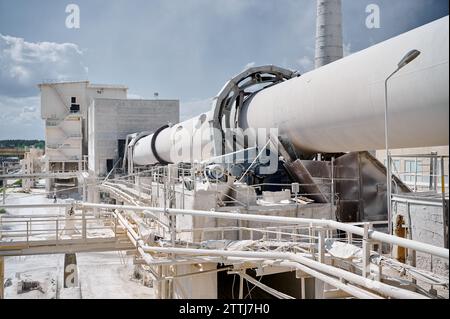 Tubular rotary furnace for lime processing and chimney Stock Photo