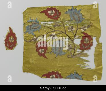 Excerpt yellow silk tissue with multi -colored embroidery, c. 1500 Fragment yellow silk tissue with multi -colored embroidery. The fragment consists of four sewing fragments. The embroidery has a flower branch with blue and red flowers and flower buds of green, pink, orange and silver. The fragment includes a fragment in the shape of a flower, with red embroidery. Persia silk. satin embroidering Fragment yellow silk tissue with multi -colored embroidery. The fragment consists of four sewing fragments. The embroidery has a flower branch with blue and red flowers and flower buds of green, pink, Stock Photo