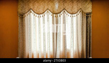 Luxurious curtains closed on window at home Stock Photo