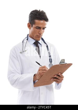 Man, doctor and writing on clipboard in studio, planning notes and healthcare information on white background. Serious medical worker with report of Stock Photo
