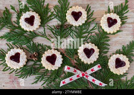 christmas bakery biscuits Spitzbuben with red jam Stock Photo