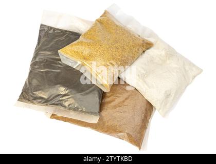 Bloodmeal, bonemeal, beem and mustard cake organic fertilizer in small packs for home gardening Stock Photo
