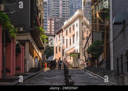 December 12, 2023: Pottinger Street, aka the Stone Slabs Street, is a street paved unevenly by granite stone steps in Central, Hong Kong.  It was name Stock Photo