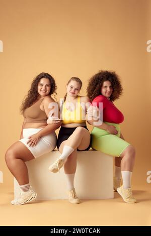 Three Multiracial Diverse Woman in Black Sportswear Posing in