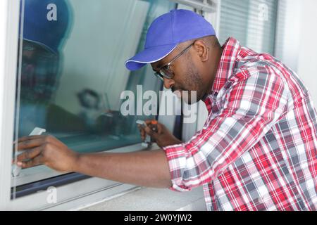 man during window maintenance service Stock Photo