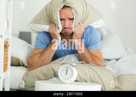 despair young man not wanting to wake up Stock Photo