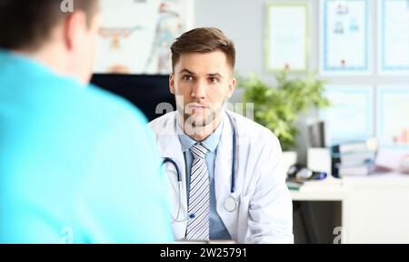 Thoughtful doctor in clinic Stock Photo