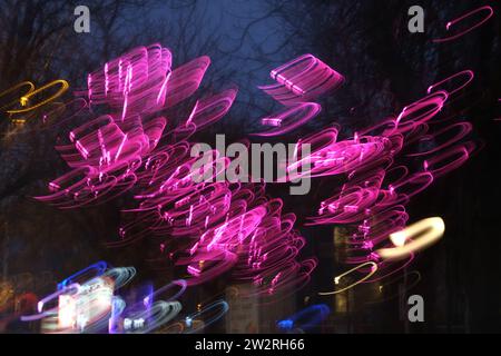 Abstract light pattern from long exposure of Christmas lights. Light trails showing intentional camera movement. Stock Photo