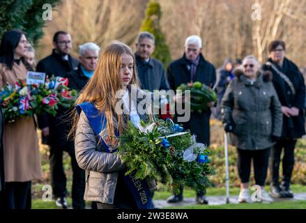 People gather to pay their respects at a wreath laying ceremony to mark the 35th anniversary of the Lockerbie bombing at the Memorial Garden, Dryfesdale Cemetery, Lockerbie. On December 21, 1988, Pan Am Flight 103 exploded over the town in Dumfries and Galloway, 40 minutes into its flight from London to New York. All 259 passengers and crew were killed, including 35 students from the University of Syracuse, along with 11 Lockerbie residents. Picture date: Thursday December 21, 2023. Stock Photo