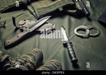 Military equipment or special agent gear concept flat lay background with copy space. Mixed media Stock Photo