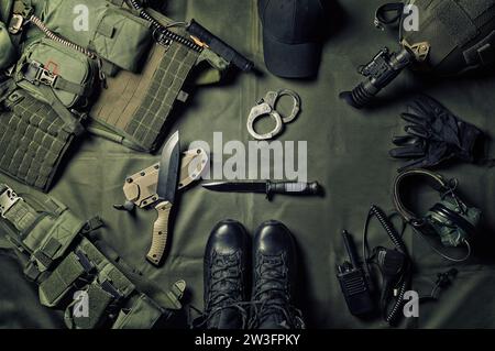 Military equipment or special agent gear concept flat lay background with copy space. Mixed media Stock Photo