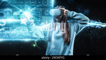 Image of a woman in virtual reality glasses pressing the buttons of the 3d screen. Industry automation and robotization concept. Mixed media Stock Photo