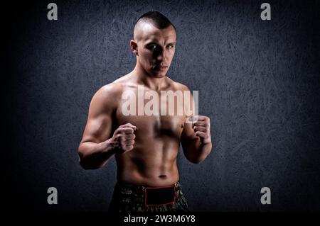 Portrait of a boxer of mixed martial arts. The concept of sports, mma, kickboxing. Mixed media Stock Photo