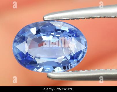 natural blue sapphire gem on background Stock Photo