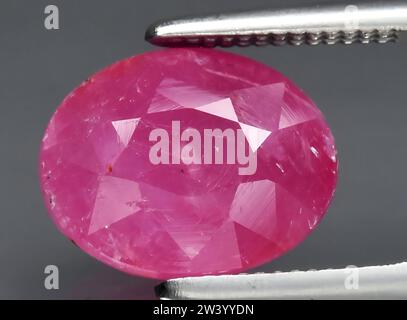 natural pink sapphire gem on background Stock Photo