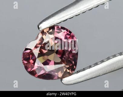natural pink sapphire gem on background Stock Photo