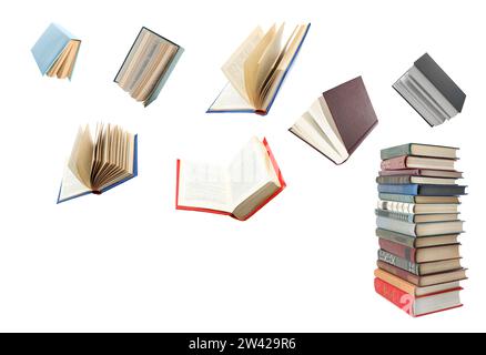 Books flying over stack on white background Stock Photo