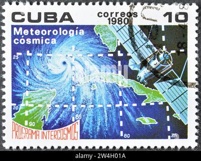 Cancelled postage stamp printed by Cuba, that shows Satellite, grid lines and map (Meteorology), Intercosmos Program, circa 1980. Stock Photo