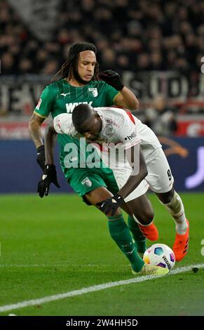 Stuttgart, Deutschland. 20th Dec, 2023. Zweikampf Kevin Mbabu FC Augsburg FCA (43) gegen Serhou Guirassy VfB Stuttgart (09) VfB Stuttgart vs FC Augsburg FCA 20.12.2023 DFL REGULATIONS PROHIBIT ANY USE OF PHOTOGRAPHS AS IMAGE SEQUENCES AND/OR QUASI-VIDEO/dpa/Alamy Live News Stock Photo