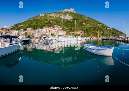 Harbour and houses of  Porto di Maratea, overlooked by the Statue of Christ the Redeemer on the top of the mountain Monte San Biagio. Stock Photo