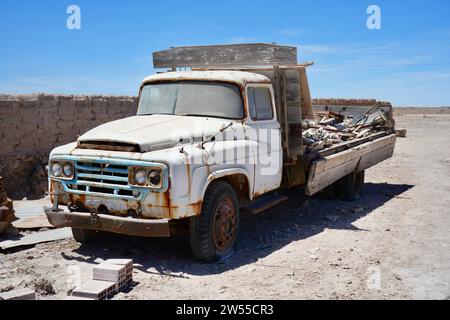 Vintage rusty abandoned Nissan Truck on the edge of the Bolivian Salt Flats. Uyuni, Bolivia. Stock Photo