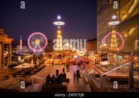 Night shot, Christmas market with Christmas pyramid, reflection in the art museum, Cube, Ferris wheel, New Palace, Schlossplatz, blue hour Stock Photo