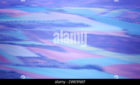 Abstract impressionist textured background with blended streaks of purple, blue, and pink, reminiscent of a painted canvas with a dreamlike quality Stock Photo