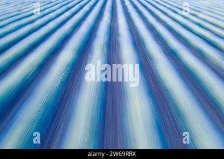 Abstract blue lines creating a sense of motion and speed with a soft gradient effect Stock Photo