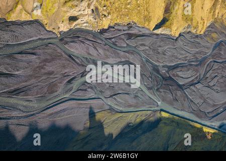Top view drone image of breathtaking drone view of curvy river estuary amidst mountains in Iceland Stock Photo
