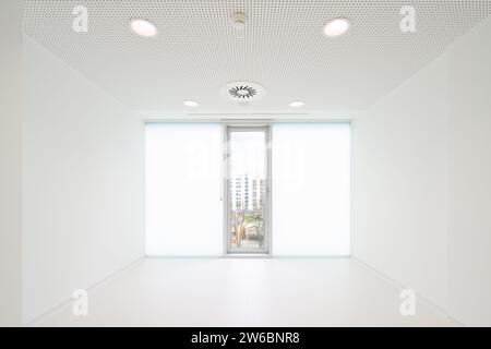 Interior of empty bright white room with glass window in hospital Stock Photo
