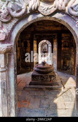 View through a linear series of parallel historic stupas in the Hindu Pashupatinath Temple (a UNESCO World Heritage Site), Kathmandu, Nepal Stock Photo